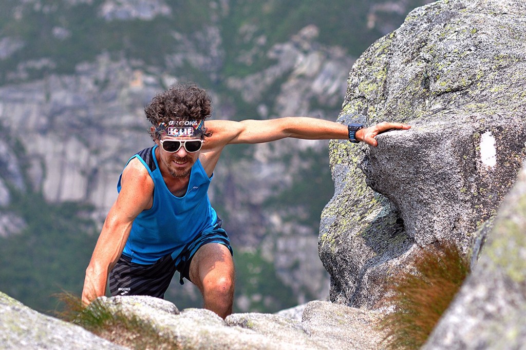 Scott Jurek climbs to the summit of Mount Katahdin on Sunday before completing the Appalachian Trail in what he claims is record time.
Luis Escobar/Brooks Running Company via AP
