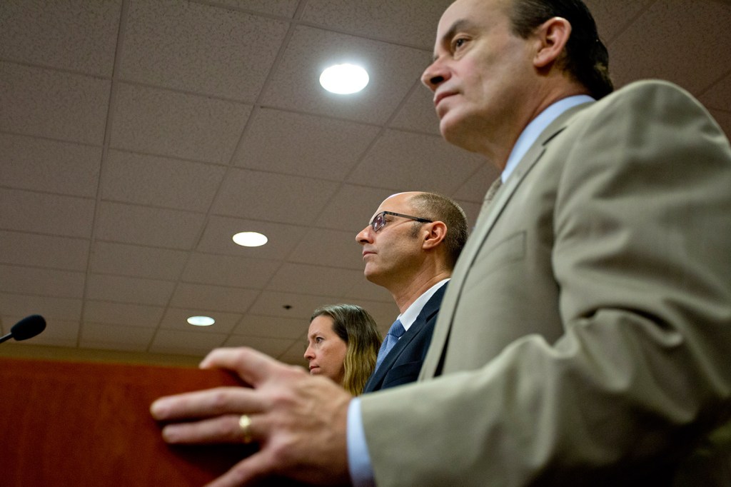 Gregory Nisbet, center, is flanked by his attorneys Sarah Churchill, left, and Matthew Nichols, right, as he is arraigned on six charges of manslaughter at the Cumberland County Courthouse on Friday.