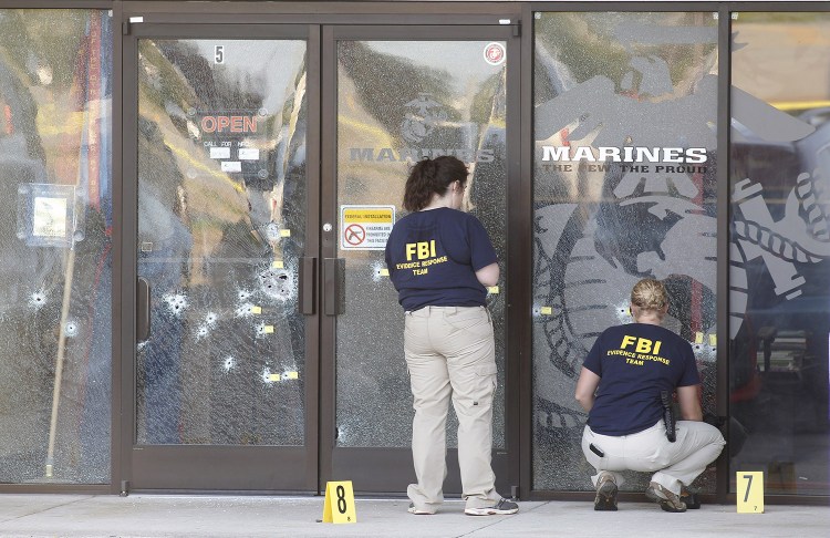 FBI agents investigate at the Armed Forces Career Center in Chattanooga, Tennessee, on Thursday after four Marines were killed by a gunman who opened fire at two military offices before being fatally shot.
Reuters