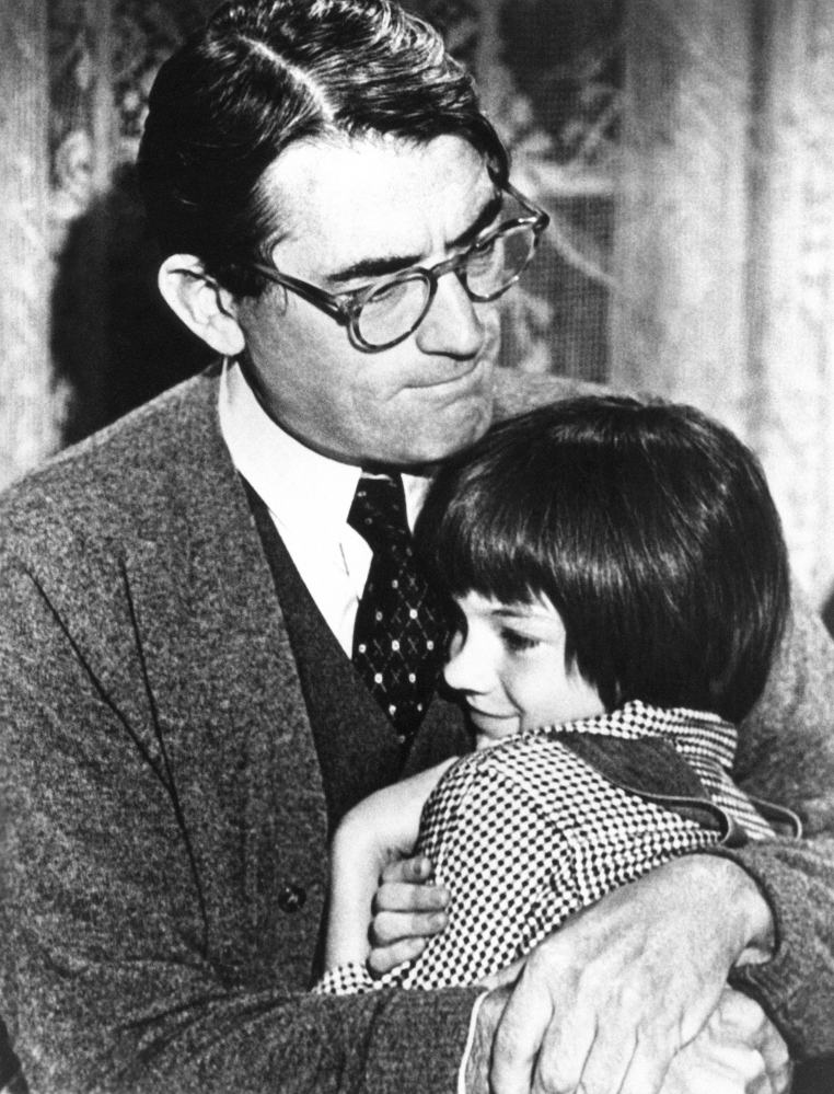 Gregory Peck as Atticus Finch and Mary Badham as Scout Finch in a scene from the movie version of "To Kill a Mockingbird." Film Image via Reuters