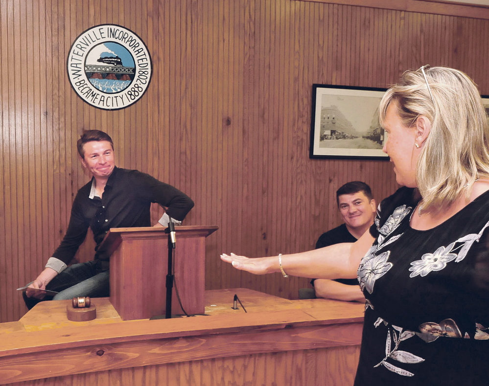 KotlasMayor Andrei Bral’nin sits in Waterville Mayor Nick Isgro’s seat in council chambers during a tour of Waterville.