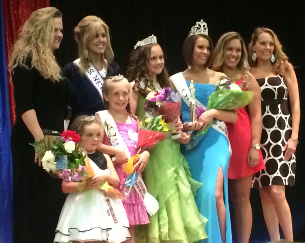 The winners of the Winslow Miss 4th of July pageant appear on stage Saturday, including Molly Lybrook, wearing the blue dress. It was later found that votes were tallied incorrectly and Lybrook didn’t win. She has decided to step down. 