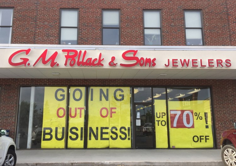 Customers in South Portland on Thursday evening found this sign in the storefront window of G.M. Pollack & Sons Jewelers.
Dennis Hoey/Staff Writer 