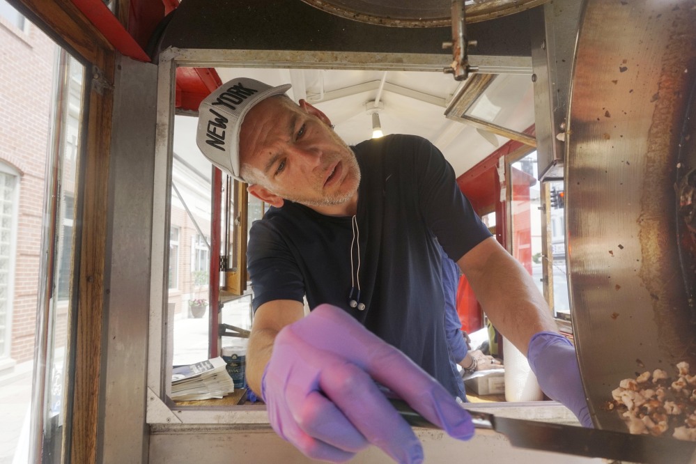 Mark Flannigan works at the Popcorn Wagon in Pittsfield, Mass., a program that teaches business skills. Employment may be up but many older workers are underemployed.