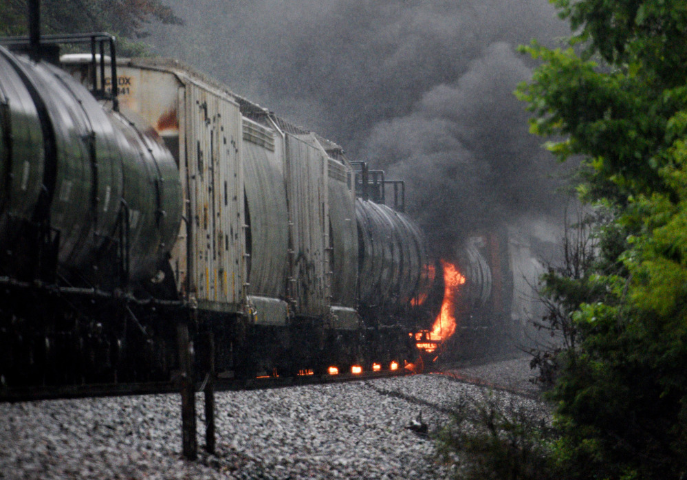 Smoke and flames rise after the derailment of a CSX train car Thursday in Maryville, Tenn. The train was carrying flammable and toxic material.