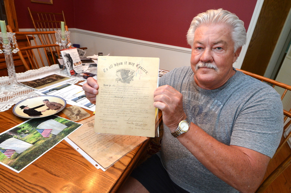 Ed Isaacs holds the July 1865 Civil War discharge papers of  his great-grandfather Edwin L. Tuttle in Norwalk, Conn.
The (Norwalk) Hour