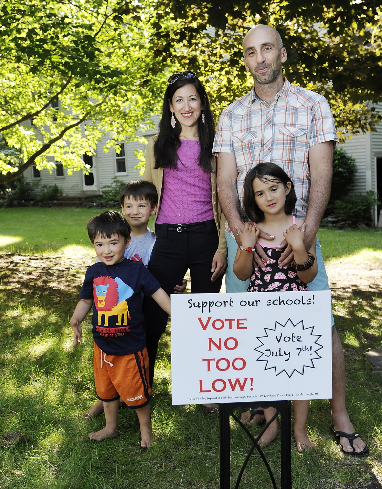 Stacey Neumann and Noah Perlut – with Nico, 4, Enzo, 2, and Rose, 6 –  say they moved to Scarborough in 2009 for the town’s schools.