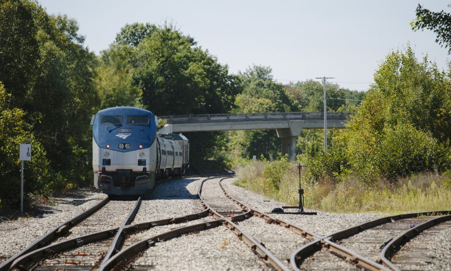 An Amtrak Downeaster train sits on the tracks near the Brunswick station.