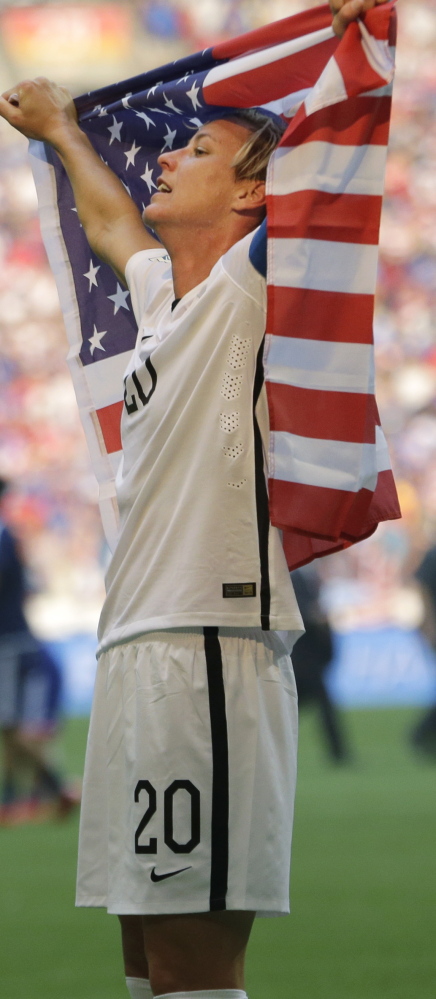Abby Wambach ended her World Cup career in dream fashion Sunday night, enveloped in the flag, celebrating a clinching victory for the United States.