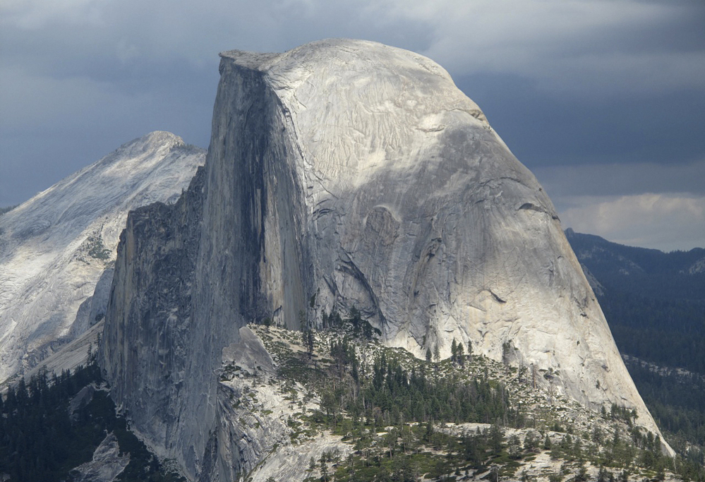 Half Dome draws climbers who insert cams into rock fissures for leverage. But it’s not likely climbers caused a piece of granite to fall off, the park geologist says.