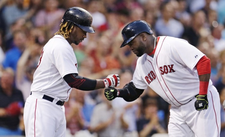 David Ortiz is congratulated by designated hitter Hanley Ramirez after Ortiz’s two-run home run in the third inning. The Red Sox scored four runs in the inning on their way to a 6-3 win.