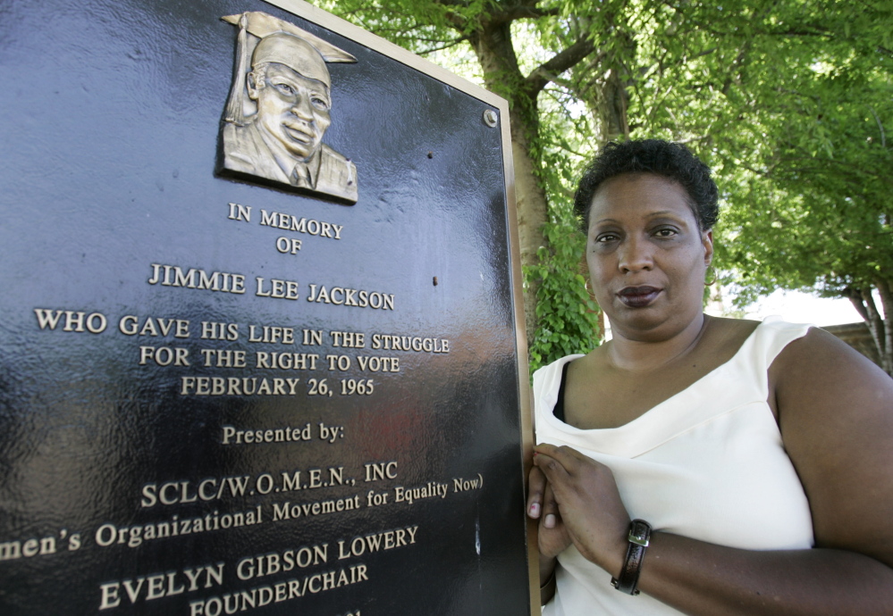 Cordelia Heard Billingsley stands next to a plaque for her father, Jimmie Lee Jackson, who was killed during a voting rights demonstration in Marion, Ala., in 1965.