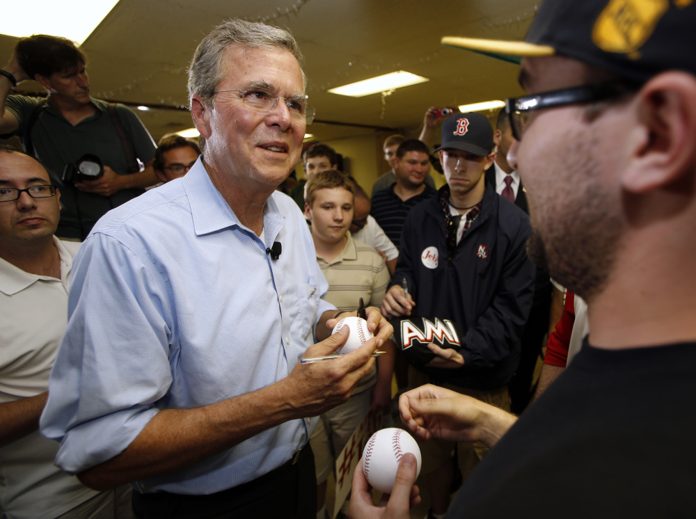 Republican presidential candidate former Florida Gov. Jeb Bush signs autographs after a town hall meeting in Hudson, N.H., in this July 10, 2015 file photo.