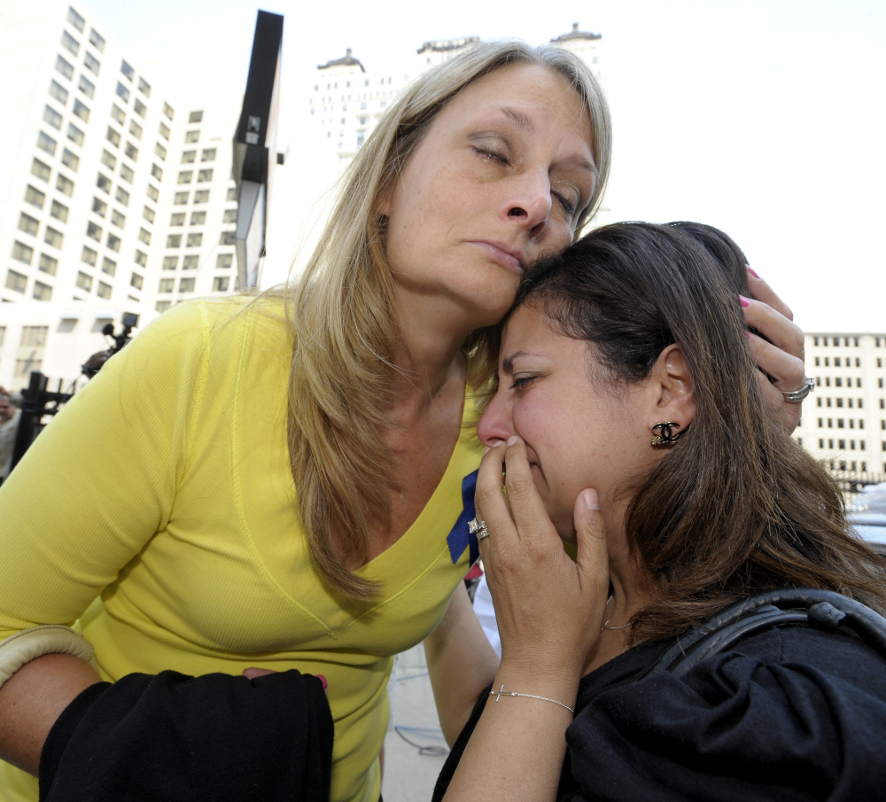 Cheryl Blades, left, of Waterford, hugs a lady who asked not to be identified after the sentencing. The lady was treated by Fata while she was pregnant twice and is still treated for an unknown condition. Thus far, her children are healthy. Blades mother, Nancy LaFrance, died of lung cancer.  The Associated Press