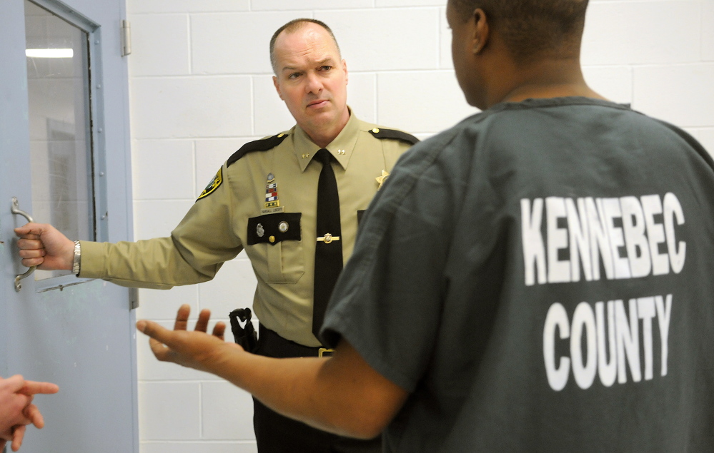Kennebec County Sheriff Randall Liberty confers in April with an inmate at the Kennebec County Correctional Facility in Augusta.