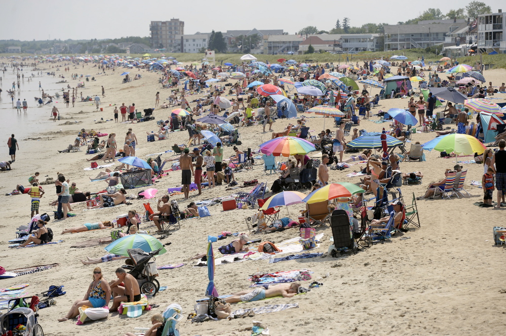 Beachgoers crowd Old Orchard Beach on Friday. Canada is typically the second- or third-most important market for Maine tourism. "In 2009 they saved us,"says Greg Dugal of the Maine Innkeepers Association, speaking of Canadian tourists who had money to spend while the U.S. economy tanked.