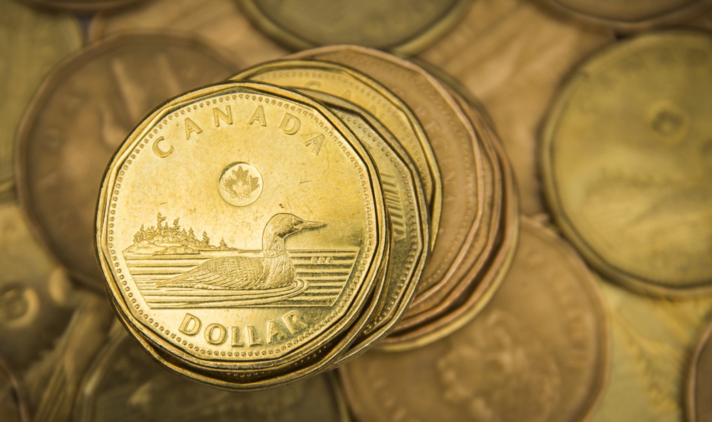 The Canadian dollar coin or “loonie,” once equal to the U.S. dollar, is now worth 77 cents. Many economists believe that Canada is in a recession.