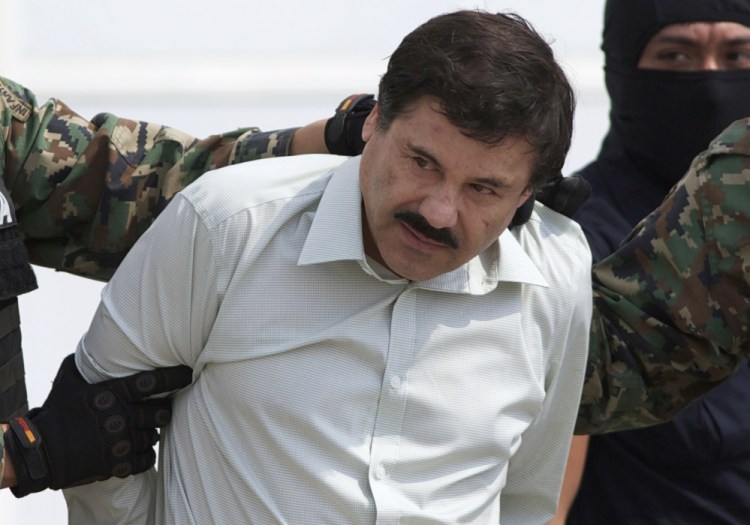  Joaquin “El Chapo” Guzman, head of Mexico’s Sinaloa Cartel, is escorted to a helicopter in Mexico City in February 2014 following his capture in the beach resort town of Mazatlan.