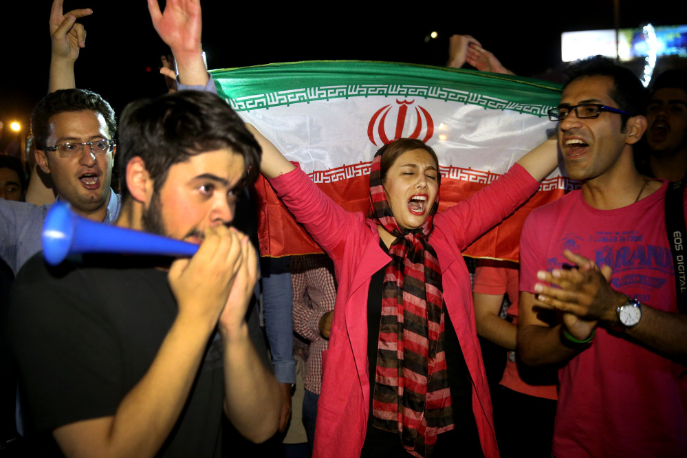 Residents of Tehran celebrate the nuclear deal Tuesday.