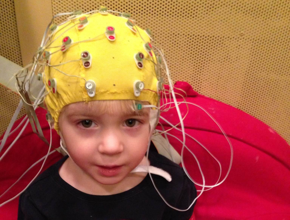 Electrodes are used to pick up how children’s brains react to speech sounds in a noisy background. 