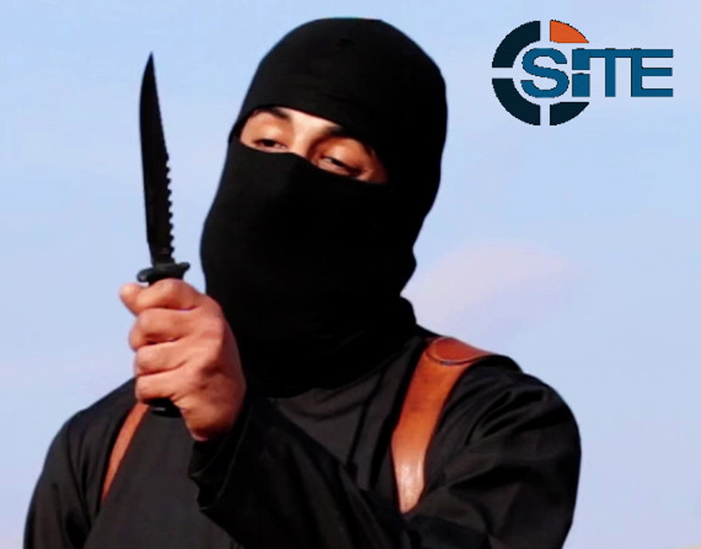 A masked, black-clad militant, who has been identified by the Washington Post newspaper as a Briton named Mohammed Emwazi, brandishes a knife in this still image from a 2014 video obtained from SITE Intel Group February 26, 2015. Investigators believe that the masked killer known as “Jihadi John”, who fronted Islamic State beheading videos, is Emwazi, two U.S. government sources said on Thursday.