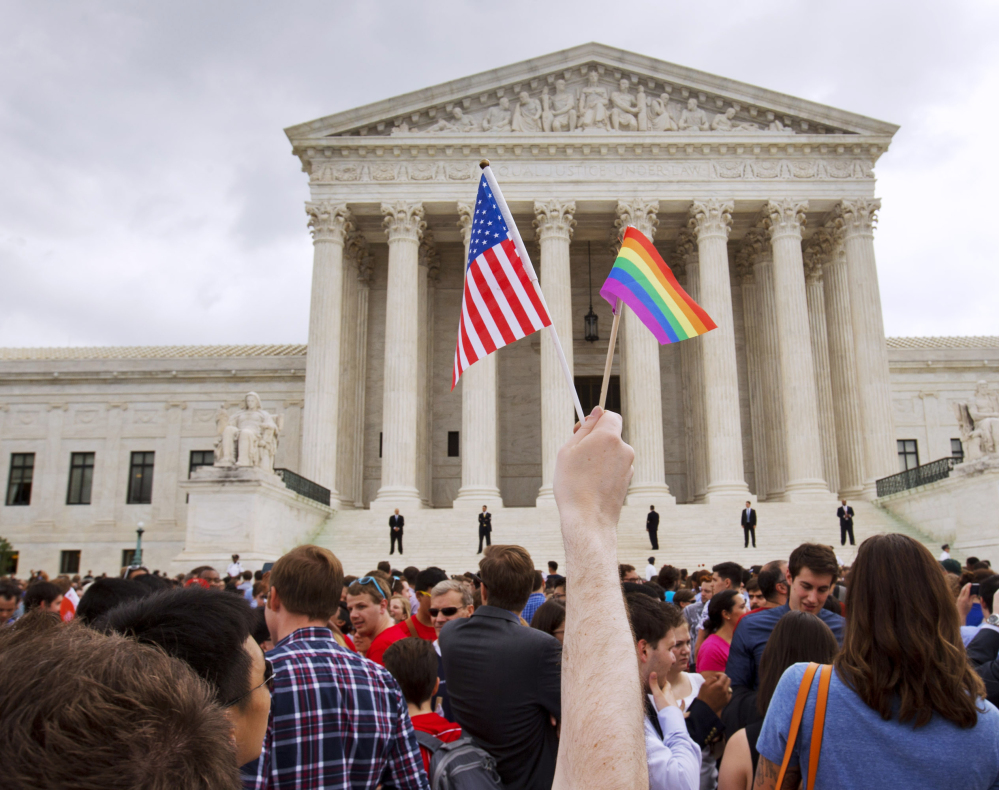 The crowd outside the Supreme Court in June celebrates after the court declared same-sex couples have a right to marry.