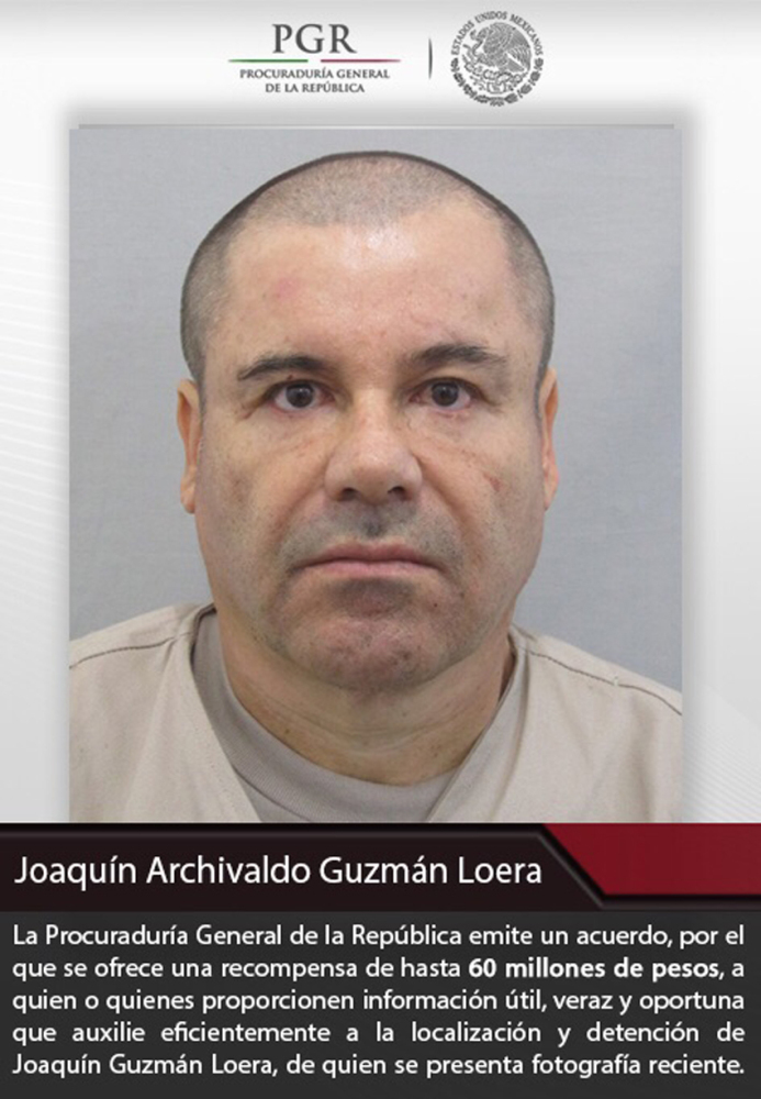A poster shows the most recent picture of Joaquin Guzman, who escaped from prison July 11.
