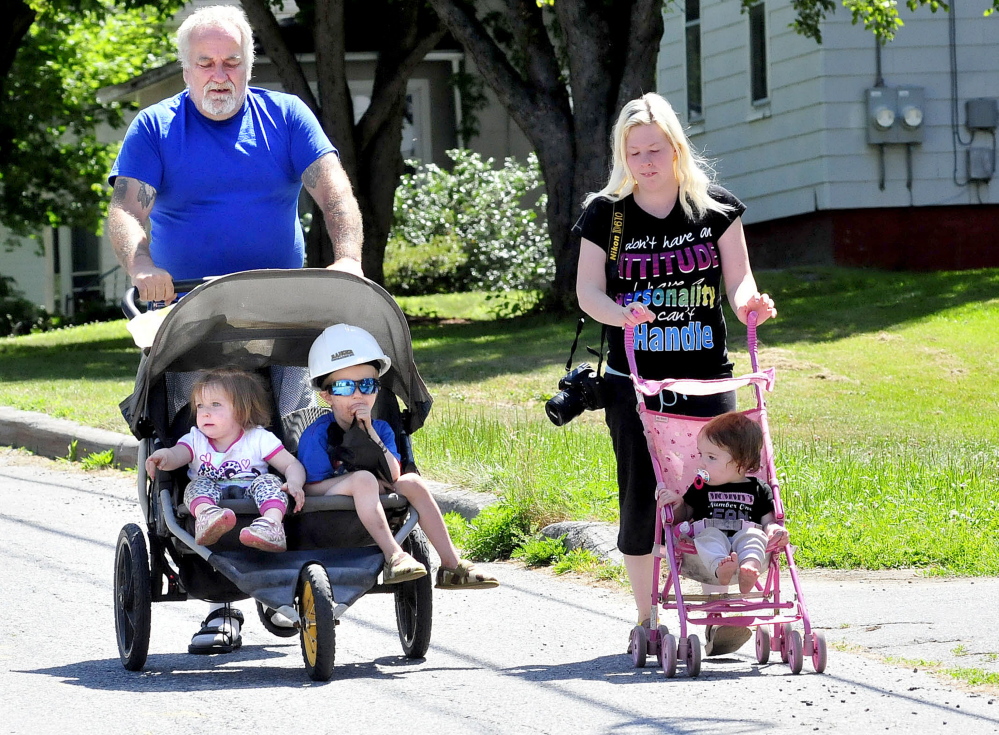 The Murray family heads to a work site in Waterville where Ranger Corp. workers and their son, Spencer, have become buddies. Harold and Felicia Murray take their children — from left, Airies, Spencer and Willow — to see the workers.