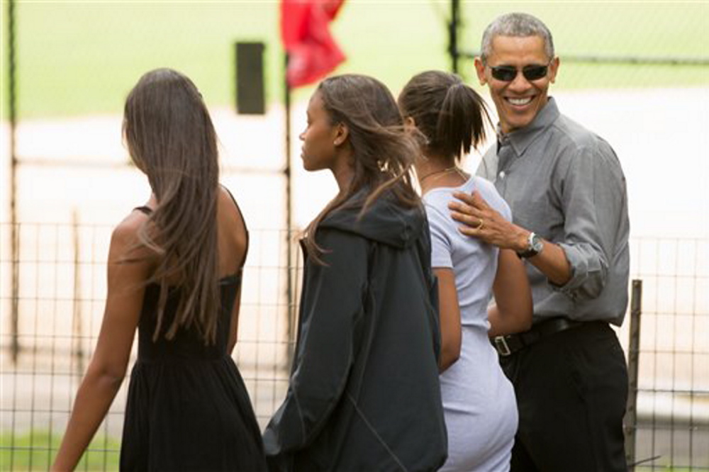 President Obama, accompanied by his daughter Sasha, second from right, and her friends, walks through Central Park in New York. Obama is spending a mainly personal weekend with his daughters in New York City.