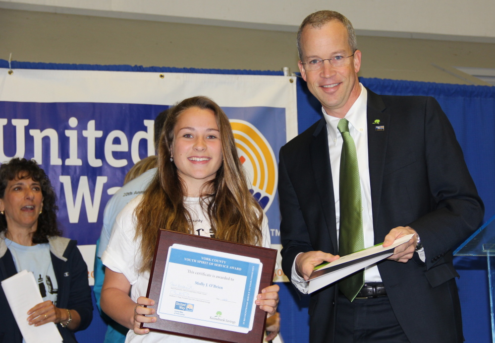 Molly O’Brien of Waterboro receives the York County Youth Spirit of Service Award from Brad Paige, president of Kennebunk Savings.