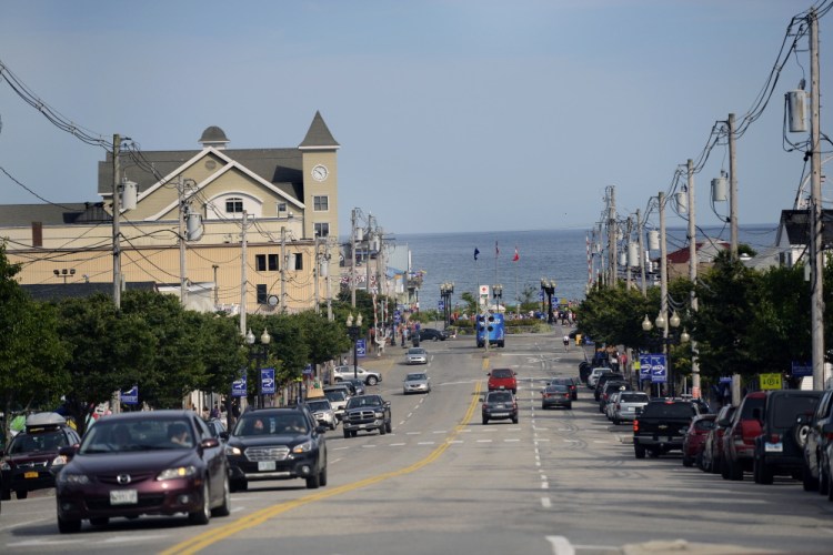 Vehicles move along Old Orchard Street last week near the town’s beach. Local ordinances to restrict where certain sex offenders can live are allowed under a 2009 Maine law.