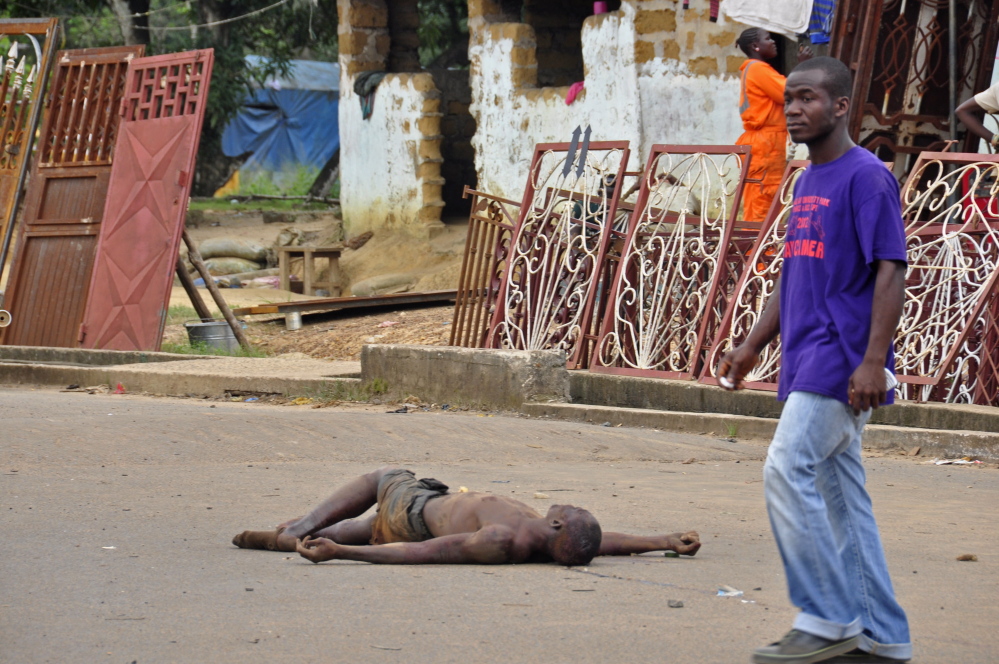 The body of a man suspected of dying of Ebola lies unattended in the street in Monrovia, Liberia, on Aug. 5, 2014. Though declared Ebola-free this May, Liberia “is once again fighting the virus within its borders,” says Dr. Kent Brantly, an Ebola survivor who contracted the disease while caring for patients in Liberia.