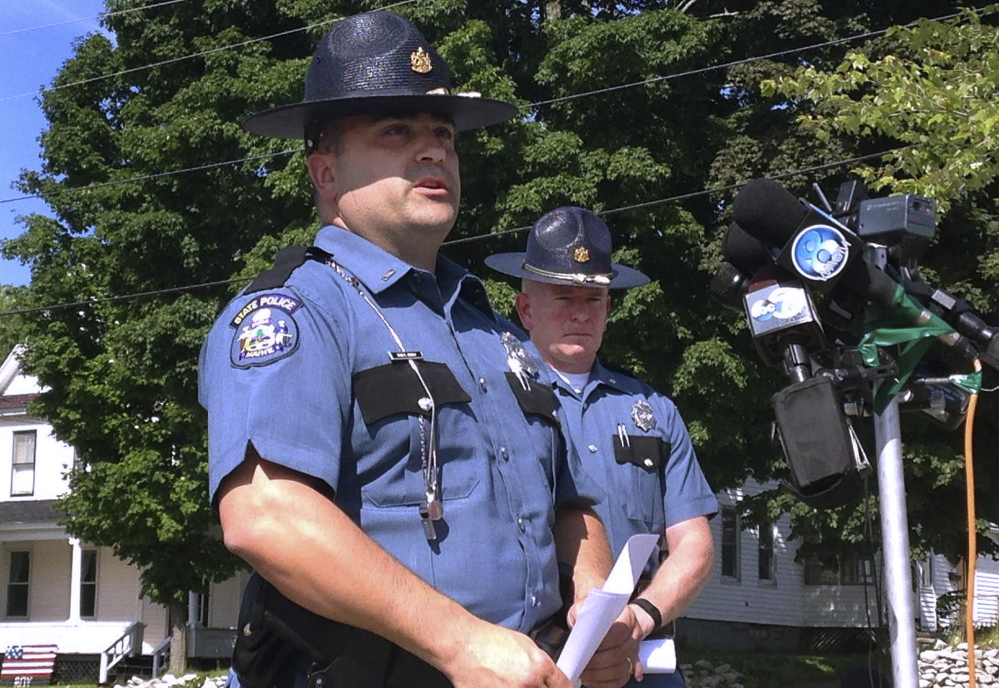 Maine State Police Lt. Sean Hashey, left, and Maj. Chris Grotton speak outside the police department in Lincoln.