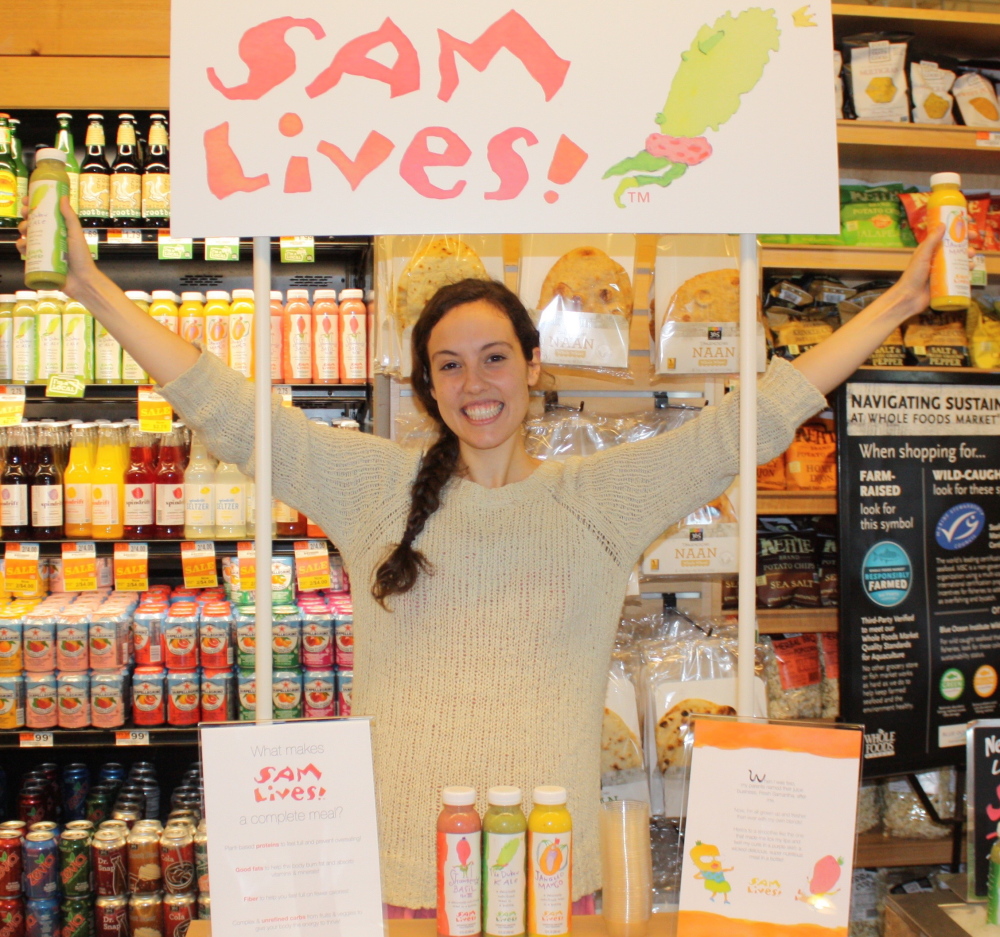 Samantha Levin of Scarborough introduces her Sam Lives! smoothie line at the Whole Foods Market in Portland on July 11. The Samantha of Fresh Samantha juice fame, Levin handed out samples during the launch. The store sold out of its stock of 500 bottles in two days.