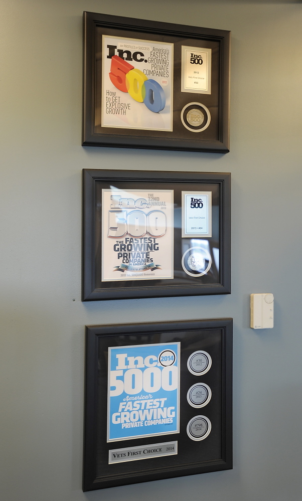 Awards hang on a wall of Vets First Choice offices in Portland.