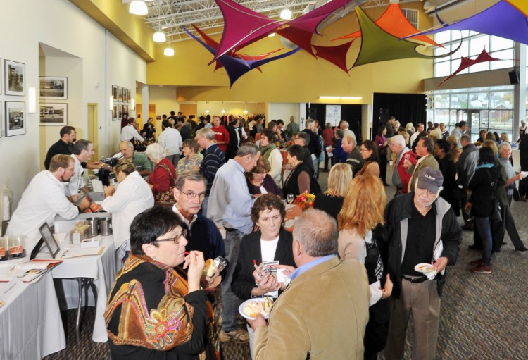 Patrons enjoy the food at the 2015 Harvest on the Harbor at Ocean Gateway in Portland. 
