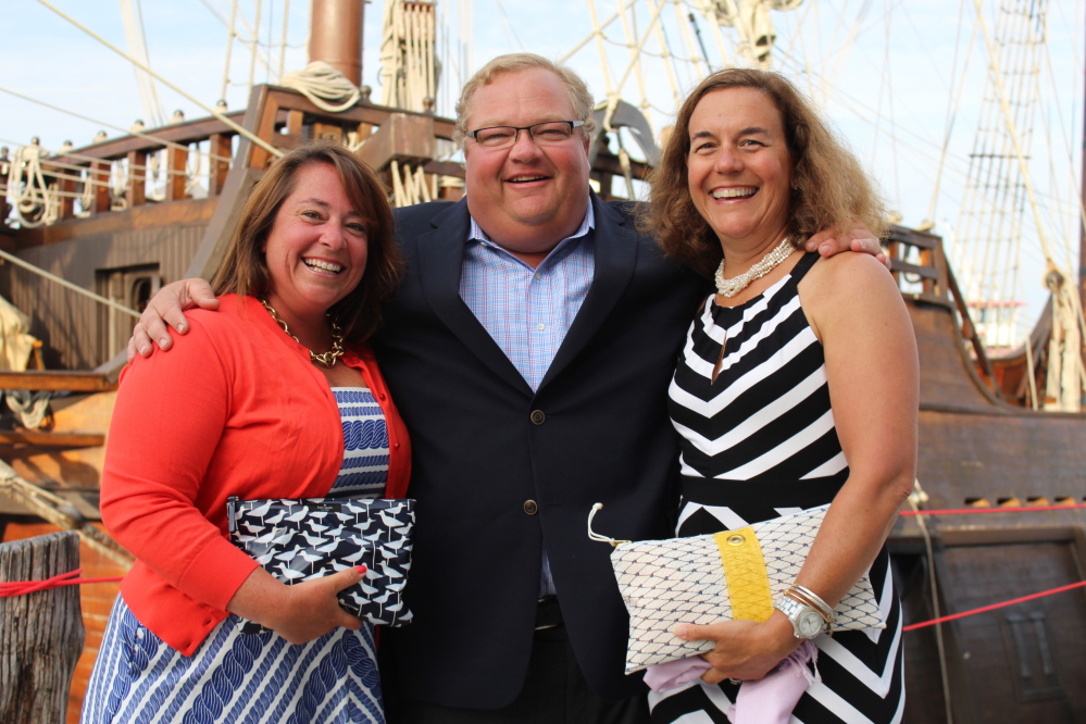Katie Hatch, executive director of SailMaine, with founder Chris Robinson and his wife Maggie, team parent of the Falmouth High School sailing team.