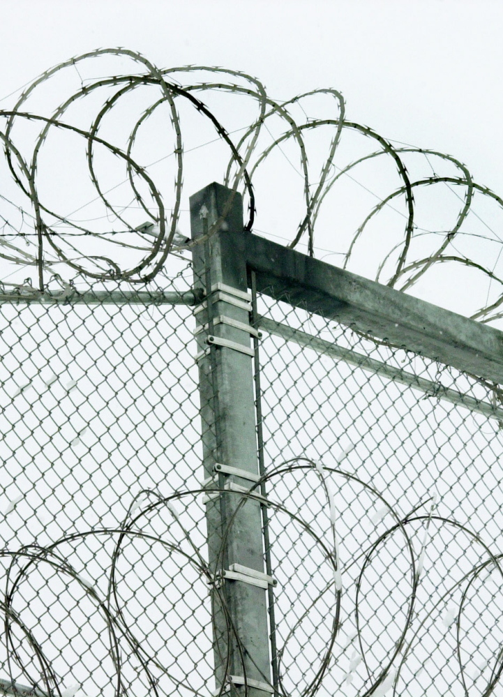 Razor wire tops the fence at the Maine State Prison in Warren. A reader urges working to prevent the high rate of incarceration.