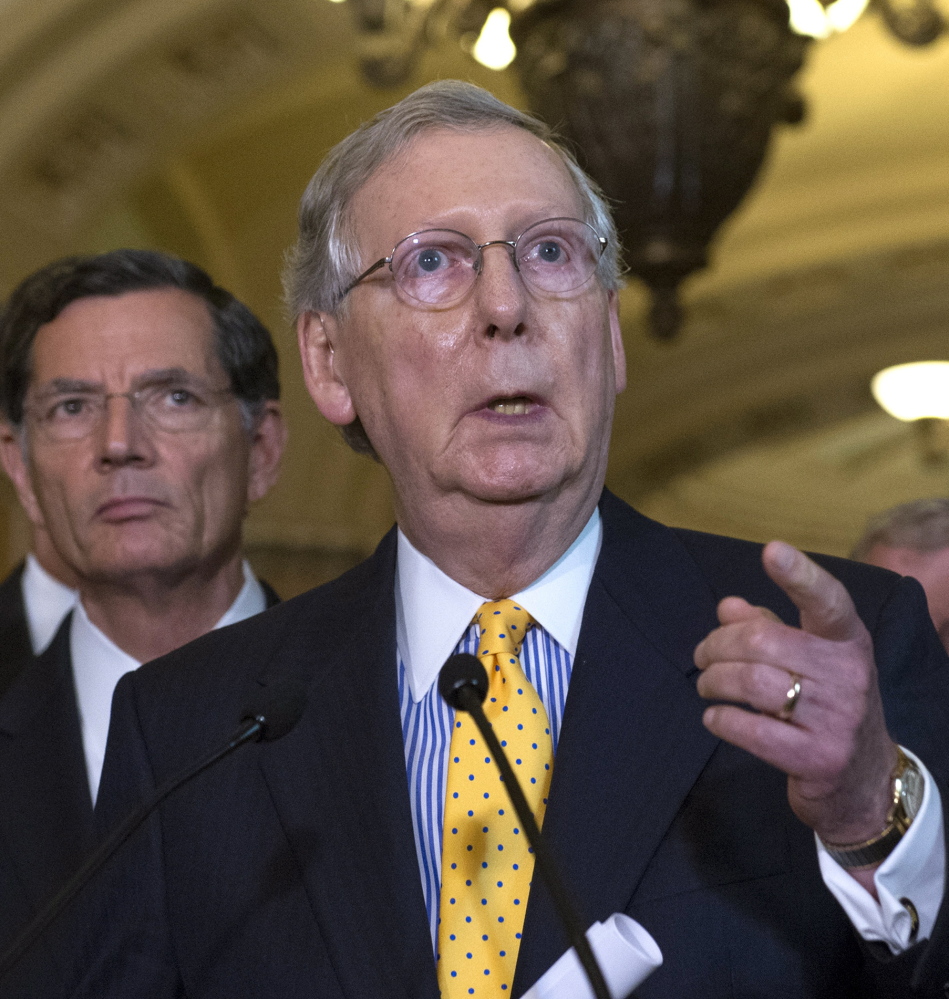 Senate Majority Leader Mitch McConnell, R-Ky., addresses the media, along with Sen. John Barrasso, R-Wyo., after a policy luncheon on Capitol Hill in Washington on Tuesday.
The Associated Press