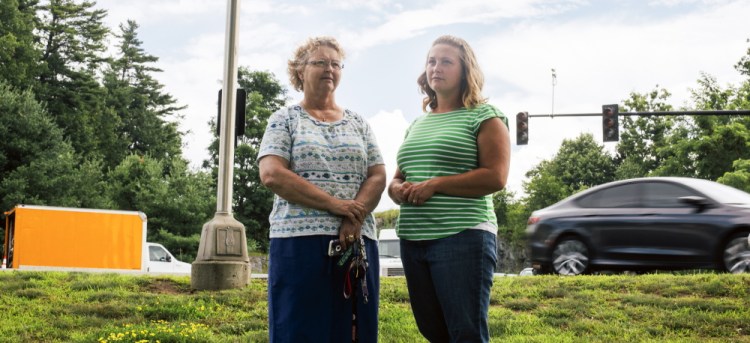 Claudia Stanley, left, and Erika Nielsen stand near the Portland intersection where they helped save a man’s life by administering CPR after he crashed into a traffic light pole. Stanley said when she arrived on the scene, which was across the street from where she works at Granite Bay Care, the man was not breathing and had no pulse.