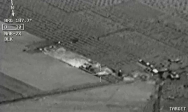 Image from aircraft cockpit video released by Turkey’s state-run agency Anadolu Friday of what they report to be Turkish warplanes striking Islamic State group targets across the border in Syria. Black object at centre above target is bomb shortly before impact. Earlier a government official said three F-16 jets took off from Diyarbakir airbase in southeast Turkey early Friday and used smart bombs to hit three IS targets across the Turkish border province from Kilis.