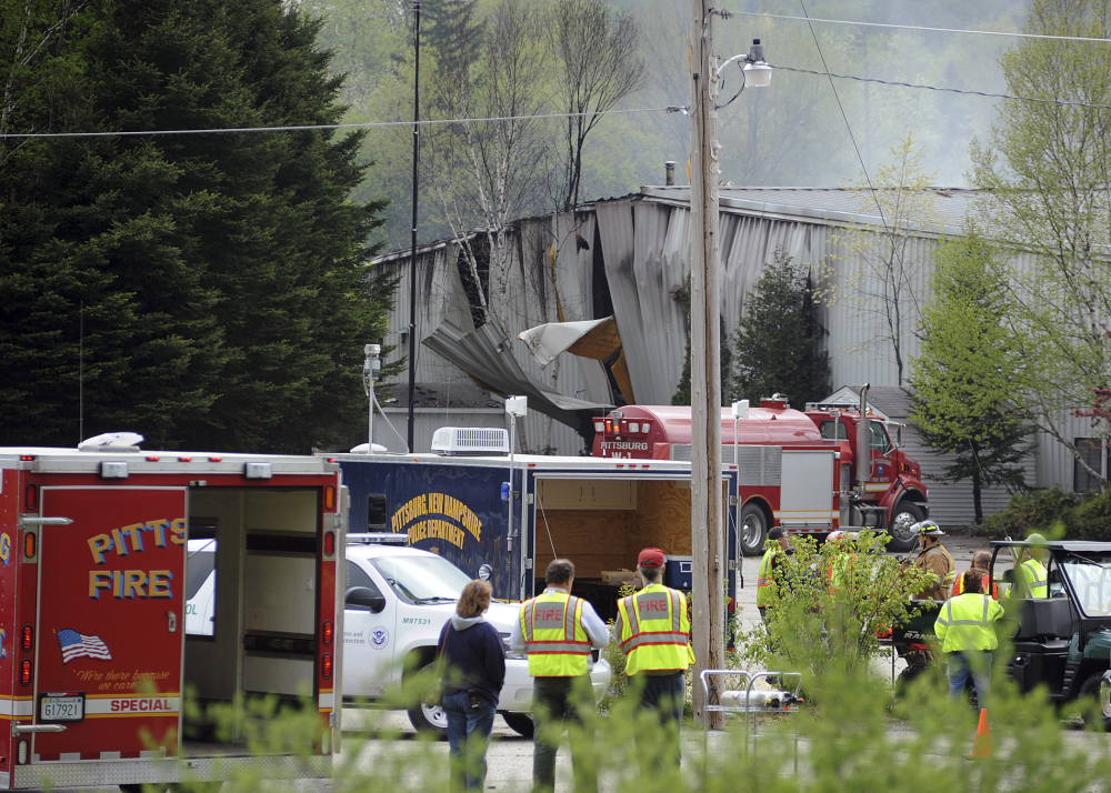 In this May 14, 2010 file photo, rescue vehicles stand outside the Black Mag gunpowder plant after an explosion at the plant killed two people in Colebrook, N.H.