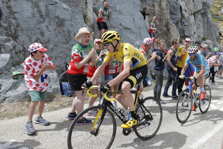 Britain’s Chris Froome, wearing the overall leader’s yellow jersey, and Italy’s Vincenzo Nibali climb during during the 20th stage of the Tour de France on Saturday.