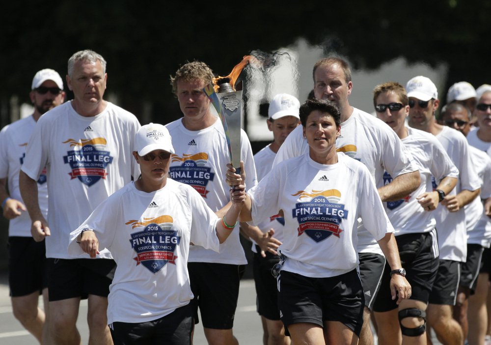 Torchbearers carry the Flame of Hope on Friday in Los Angeles, where some 6,500 athletes from around the world converged for the 2015 Special Olympics World Games.