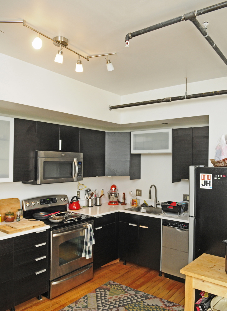 A sprinkler head and pipes in the kitchen are seen in the second floor apartment above Monkitree gallery in Gardiner.