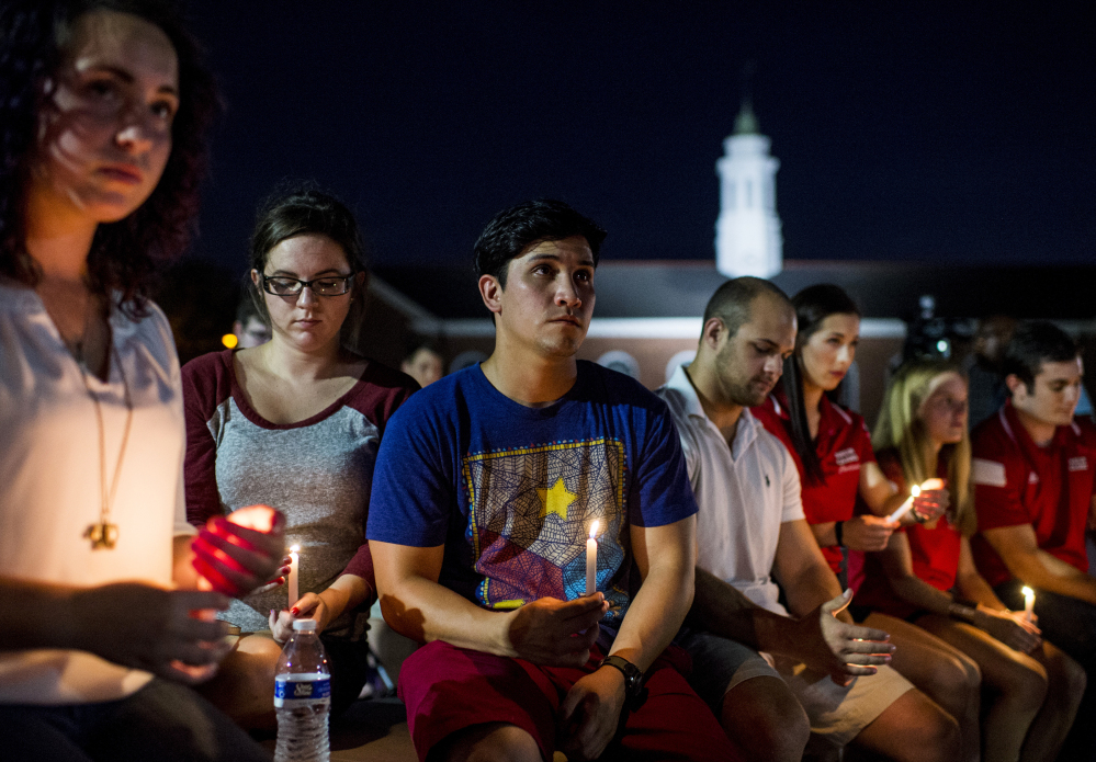 Students gather during a vigil Friday night for The Grand 16 theater shooting victims at the University of Louisiana at Lafayette. John Russell Houser stood up about 20 minutes into Thursday night’s showing of the film “Trainwreck” and fired on the audience with a semi-automatic handgun.