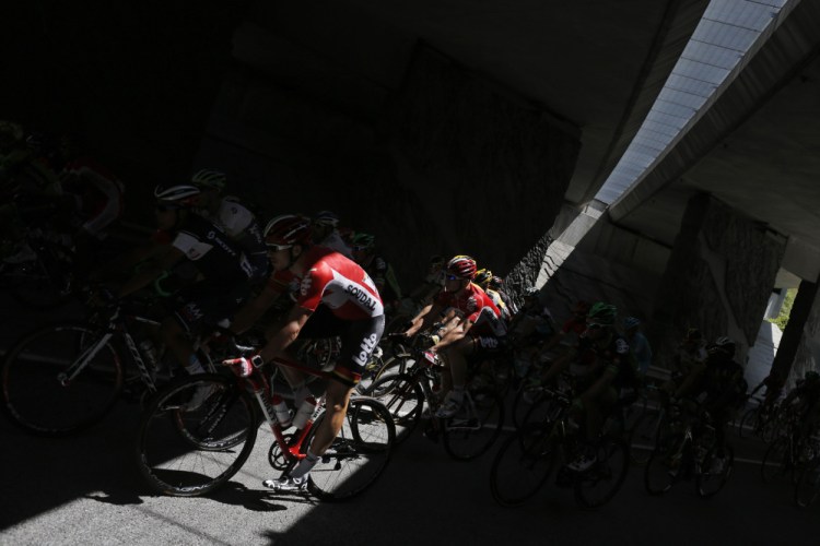 The pack passes through a tunnel during the 20th stage of the Tour de France on  Saturday.