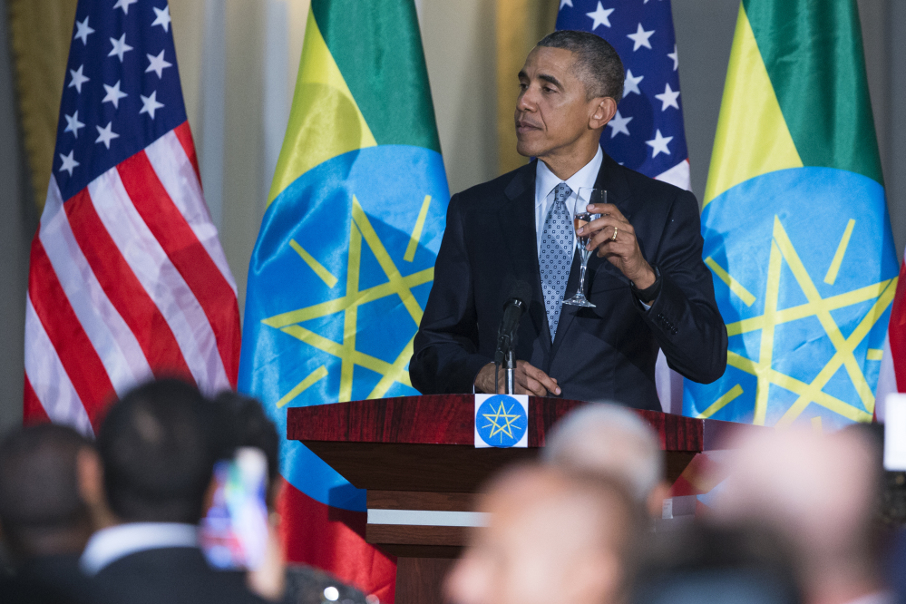 President Obama offers a toast during a state dinner hosted by Ethiopia’s prime minister on Monday, He has unleashed a verbal attack on Republican presidential hopefuls.