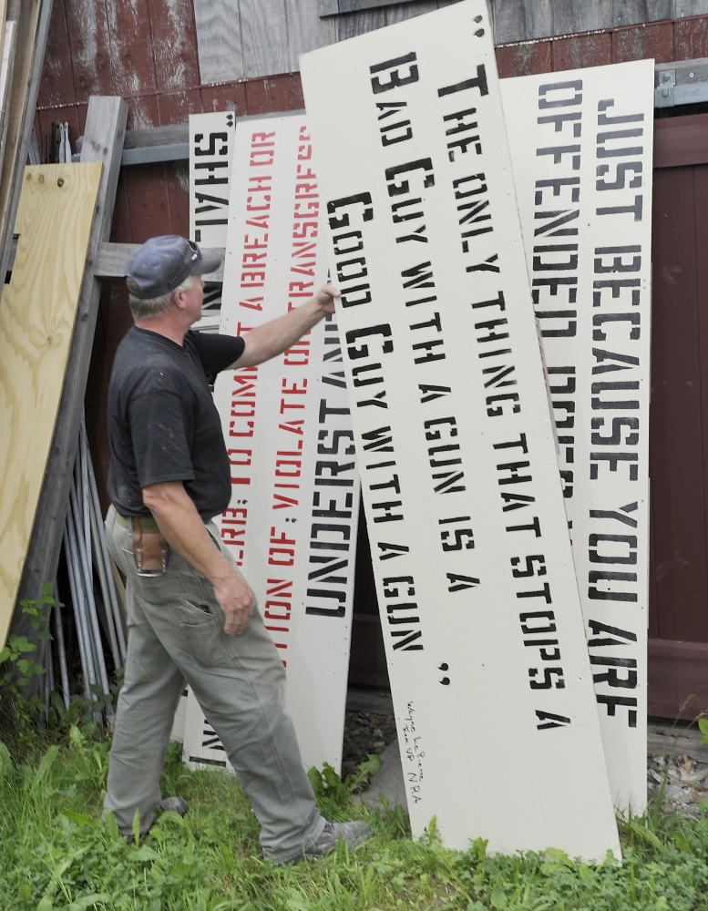Linc Sample, a former Boothbay Harbor selectman, has an array of yard signs that he began posting in 2006, hand-painting each one with stencils.