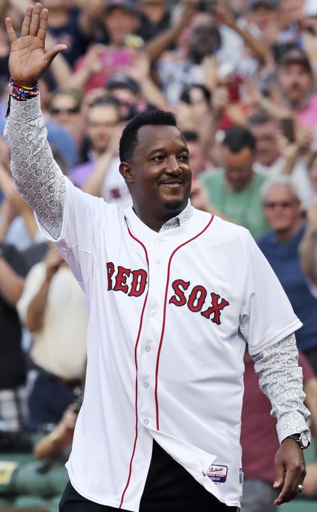 Pedro Martinez waves to fans during the number retirement ceremony. “Today I’m extremely fortunate and humbled …” Martinez told the Fenway Park crowd.